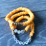 Orange Vinyl ‘Believe’ Bracelet